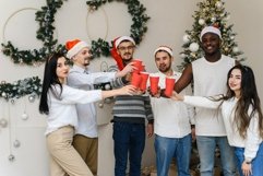 Multiethnic people say a toast for Christmas and smile Product Image 1