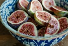 Fresh cut figs in decorative bowl Product Image 1