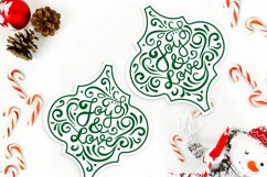 christmas arabesque ornaments on holiday background with candy canes