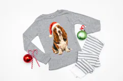 Festive dog digital graphic showing a seated Basset Hound in warm brown, cream, and black tones wearing a bright red Santa hat with textured white trim.