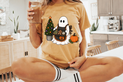 Holiday baking ghost illustration showing a ghost holding a tray of Christmas cookies while standing next to a decorated tree and orange pumpkin.