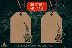 Christmas gnomes svg design being used as a Christmas gift tag