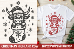 This Christmas Highland Cow SVG features an adorable cow in a Santa hat peeking out of a snowflake stocking with snowflakes and stars all around. 