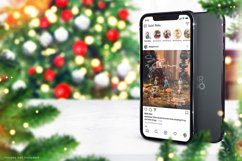 Winter Instagram mockup of two Phones on Christmas Background with Christmas Tree, decorations, and Holly leaves