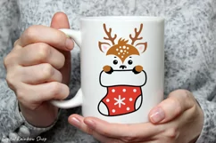 Baby reindeer peeking out of a sock png clipart