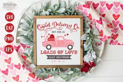 Cupid Delivery Co script text  with drawn pink vintage truck filled with pink and red hearts on a white sign with a wooden frame