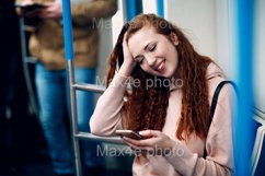 Young woman with mobile phone in subway. Wi fi in metro Product Image 1