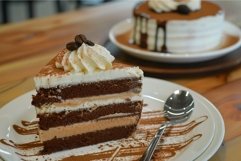 Delectable tiramisu cake slice on plate Product Image 1