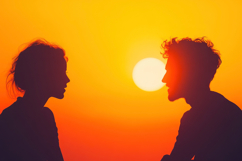 Silhouette of a Couple at Sunset Background Wallpaper Product Image 1
