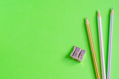 School and office supplies on office table, green background Product Image 1