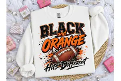 Black and Orange Hits Different PNG Tee Product Image 1