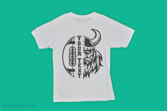 The image shows a white t-shirt featuring a bold design of a football and Viking. The design is split vertically: on the left side, there is a football with the text "YOUR TEXT" in large, bold letters, and on the right side, a Viking face with a helmet an
