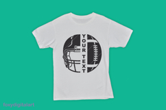 White T-shirt featuring a bold black circular football design, split down the center with a football helmet on the left and a football with laces on the right, and the vertical text “YOUR TEXT” in the middle.