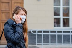 woman wears medical mask in the empty street. Product Image 1