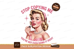Woman applying lipstick with pink dress and pearls Product Image 1