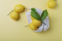 Fresh biological lemons with green leaves Product Image 1