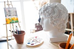 Interior of painting studio of freelance artist. Gypsum head Product Image 1