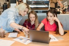 Concentrated Asian and Caucasian students discussing Product Image 1