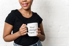 White porcelain mug in the hands of a black woman mockup Product Image 1