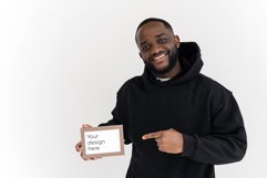 Black man pointing at an empty frame with mockup Product Image 1