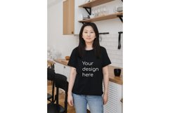 Young asian woman with mockup on black t-shirt at home Product Image 1