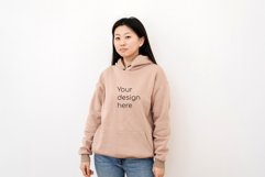 Asian woman in hoodie with mockup for your design or drawing Product Image 1