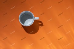 Empty tea cup on orange paper background. Coffee mug Product Image 1
