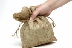 Woman hand holding burlap sack isolated on white background Product Image 1
