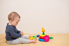 Adorable baby playing with educational toys Product Image 1