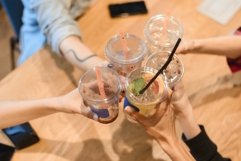 Top view of toast. People clink glasses of coffee in a cafe Product Image 1