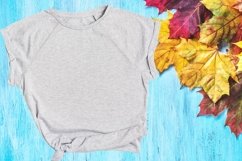 Gray t-shirt mockup on wood background