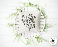 black dry weeds outline drawing on a white pillow