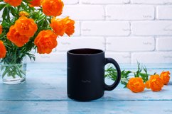 Black coffee mug mockup with globeflowers in the glass Product Image 2