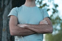 Young caucasian man walks in a park Product Image 1