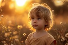 Young child looking up in wonder at golden hour sunset Product Image 1