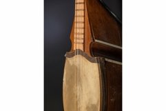 Part ancient Asian stringed musical instrument on black Product Image 1