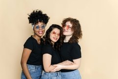 Multiethnic girlfriends smiling at the camera, posing Product Image 1