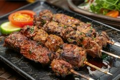 Succulent grilled skewers on plate with fresh vegetables Product Image 1