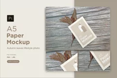 A5 paper mockup with dry leaves on wooden background Product Image 1