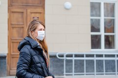 woman wears medical mask in the empty street. Product Image 1