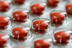 Close up of red pills blister pack staying in order Product Image 1