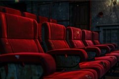 Rows of empty red seats inside a dark and deserted cinema Product Image 1