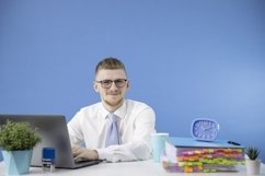 Handsome man dressed in classic shirt with blue tie Product Image 1