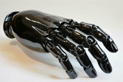Black robotic hand opening its articulated fingers Product Image 1