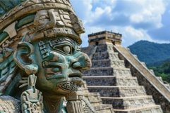 Ancient mayan statue with pyramid background Product Image 1