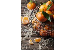 Sweet fresh tangerins on the vintage table, selective focus Product Image 1