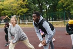 Friends doing warm-up before jogging Product Image 1