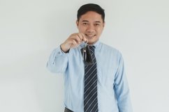 Salesman giving a key Product Image 1