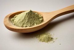 Wooden spoon full of green matcha powder Product Image 1