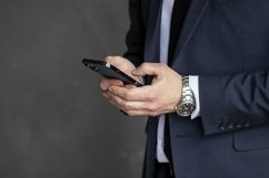 portrait of a businessman in a dark blue suit in the office Product Image 1
